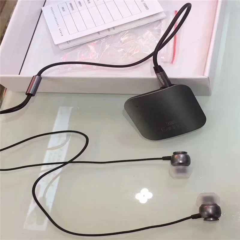 Bluetooth audio receiver with lavalier clip for running headphones in black, grey, or red
