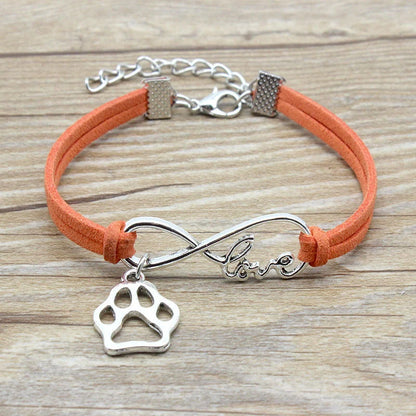 Hand-woven Infinite Love Pet Bracelet in various colors, showcasing the bow shape and alloy material.