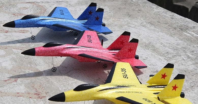 Blue fixed-wing educational toy aeroplane with 390mm length demonstrating flight with remote control