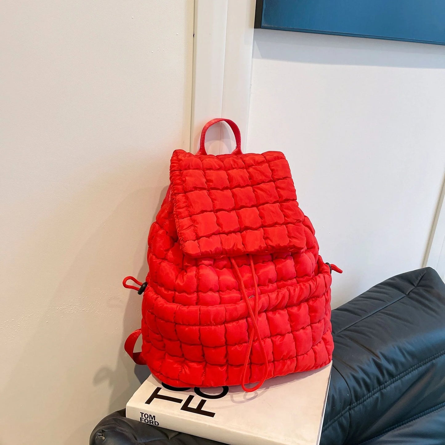 Soft, quilted puffer backpack in a variety of colors, perfect for autumn and winter wear