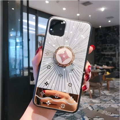 Gold-plated iPhone ring stand holder adorned with luxury diamond crystals, shown in rose gold and white gold colours.