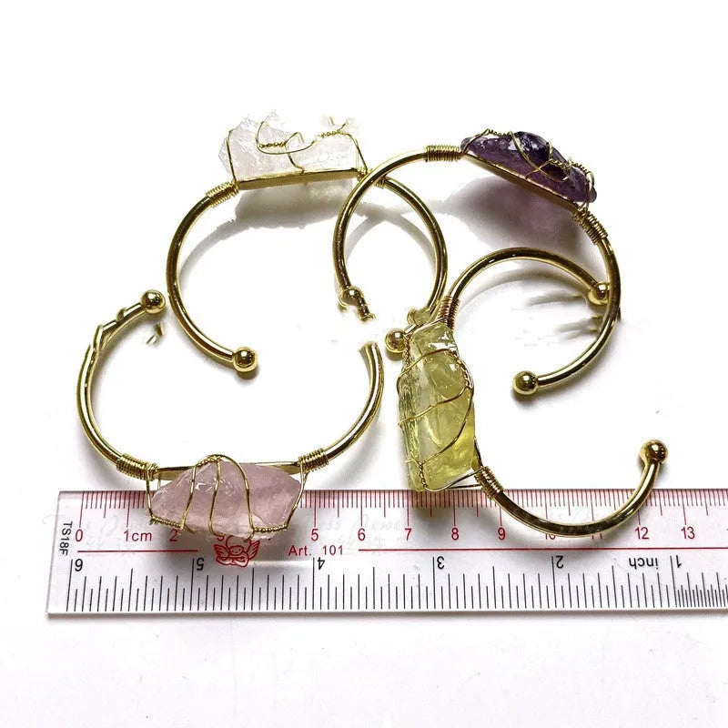 Unshaped natural crystal rough stone bracelet with gold winding metal accents in geometric design
