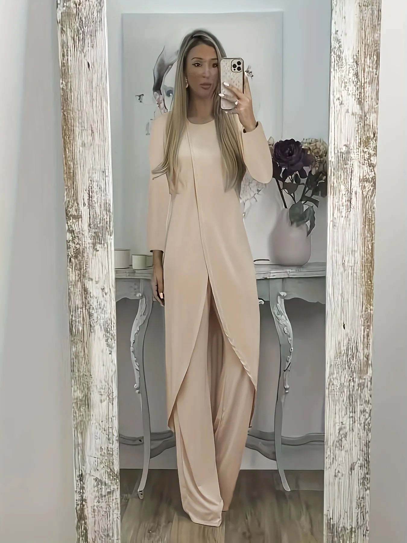 Casual black polyester two-piece lounge set with long sleeves and loose fit trousers on a hanger.