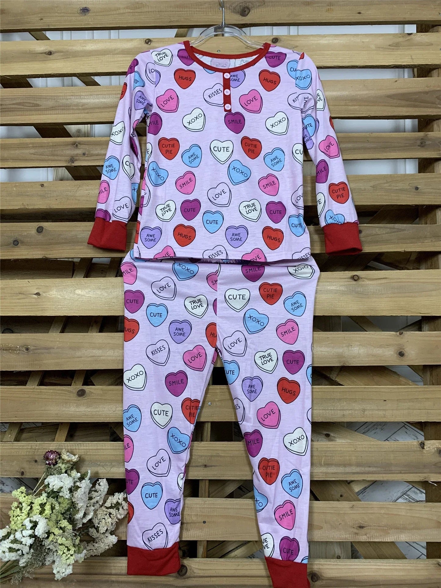 Cozy family matching Valentine's Day pajamas with heart-print design in cotton fabric