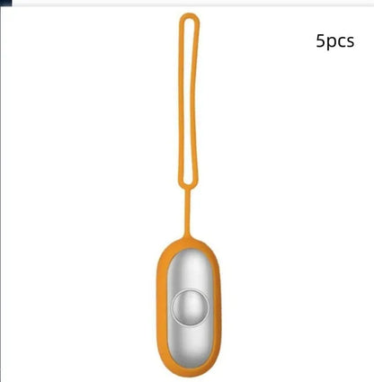 Hand-held micro-current sleep aid device in grey, green, and orange colour options