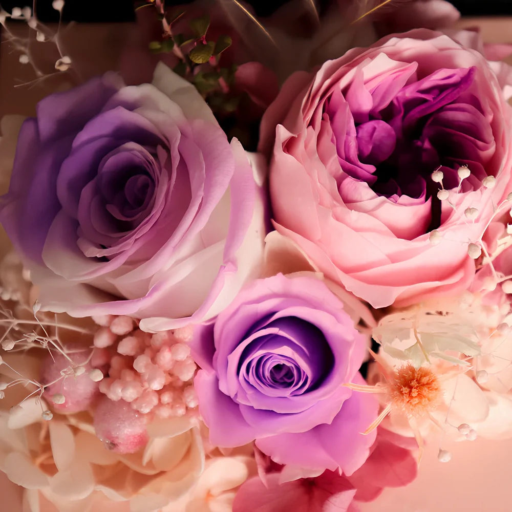Preserved eternal flower gift box with roses, carnations, and hydrangea in red and pink colours