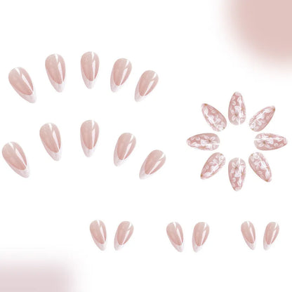 Short glossy almond artificial French nails with glitter flower design on white tips