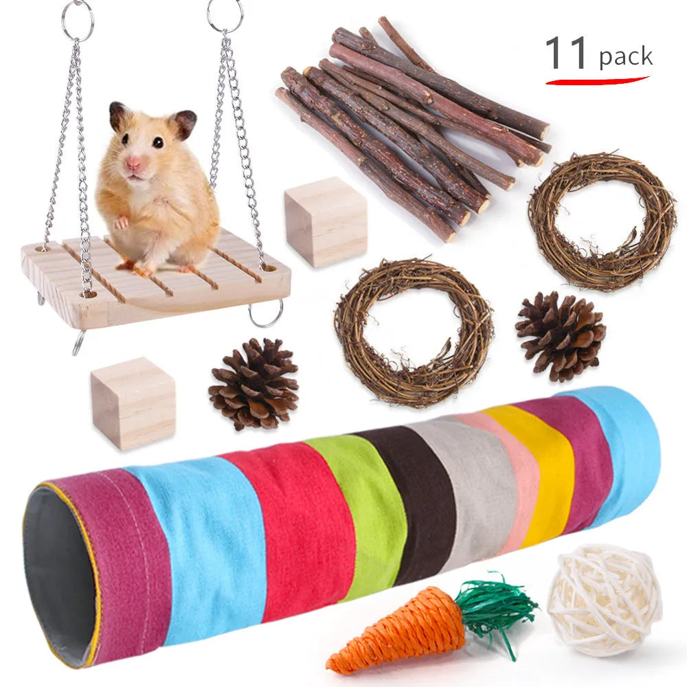 Assortment of wooden and natural fibre chew toys for small pets including balls, rings and woven shapes.