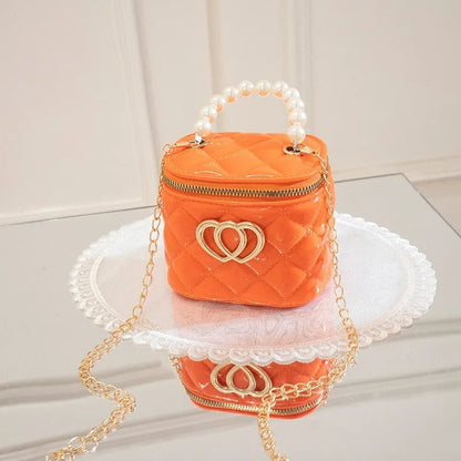 PVC bucket-style gel bag with a heart-shaped pattern, shown in apricot colour.