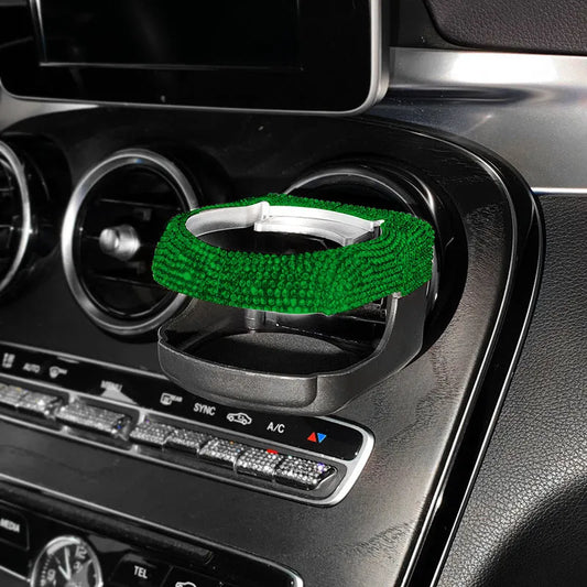 White diamond rhinestone car cup bracket measuring 8.5x9.5x5.5cm attached to vehicle air outlet