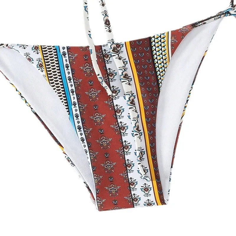 Women's mixed colour printed lace-up swimsuit with side split, shown as a one-piece