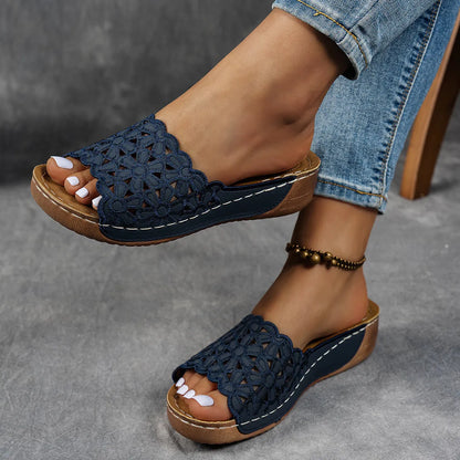 Women's black wedge beach slippers with flower cutout decoration on the PVC upper