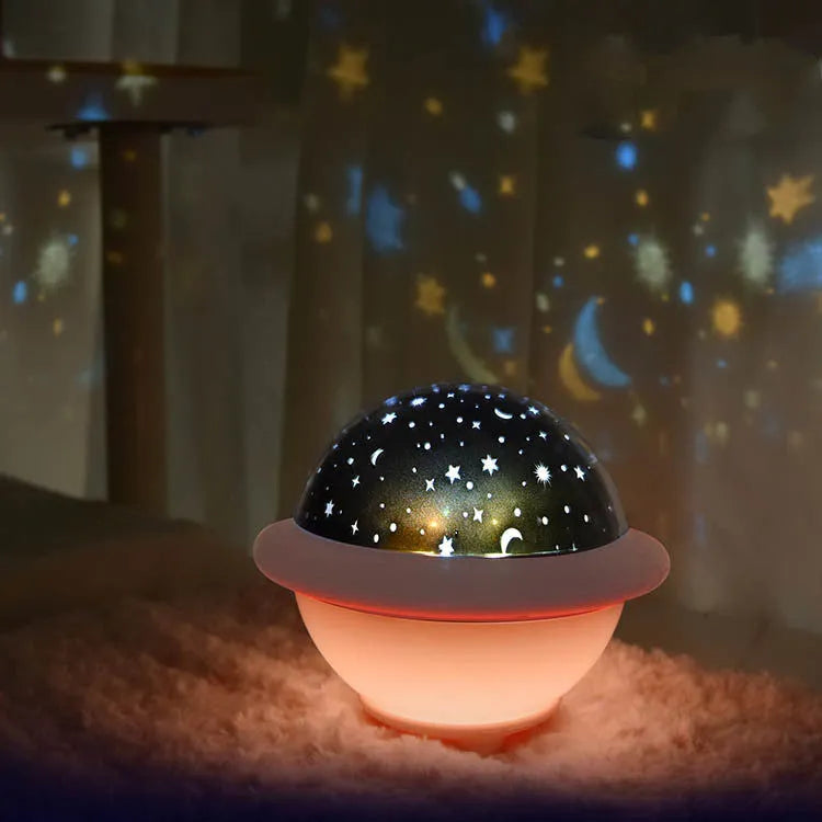 UFO-shaped starry sky light projection lamp in green, pink, or white, measuring 15.1 cm wide