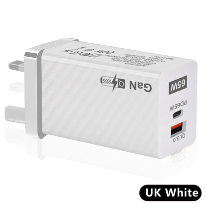 White or black GaN 65W universal laptop charger with USB-C port and compact design next to EU and US plugs