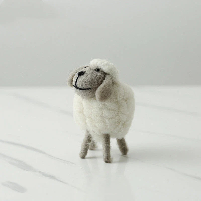 Adorable plush sheep decorations in various sizes and color combinations, perfect for adding a cozy, farmhouse-inspired touch to any home.