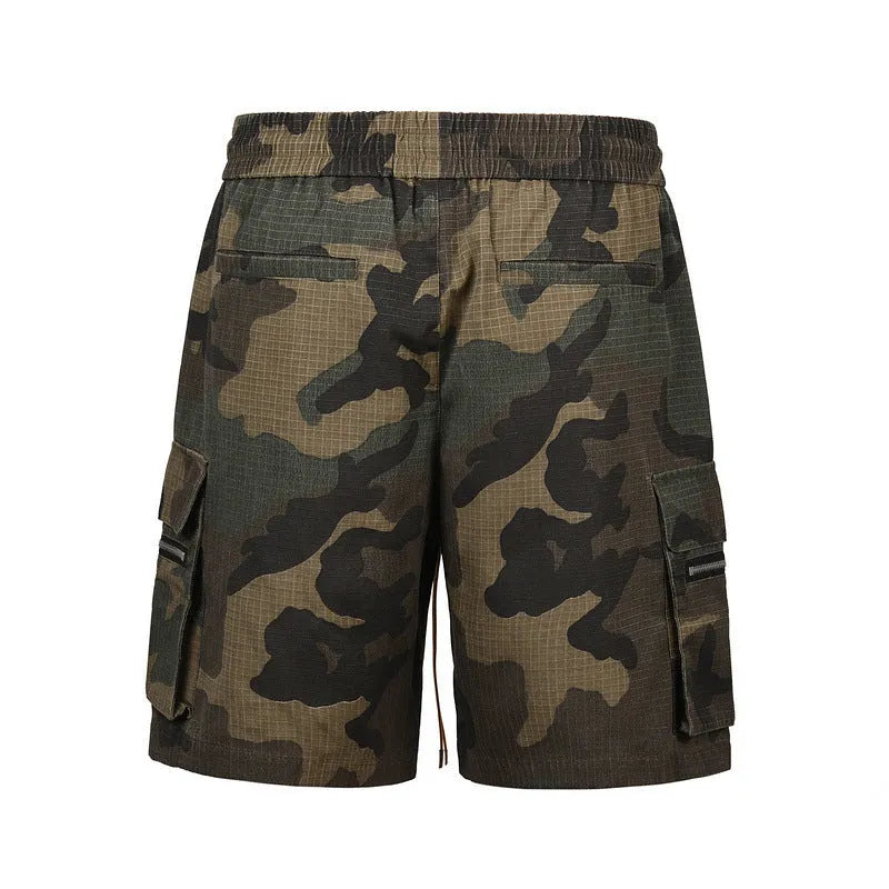 Green H215 camouflage cotton work shorts with multiple pockets on a mid-waist, loose-fit model.