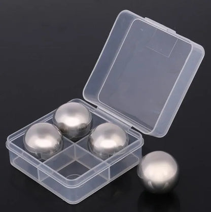 Set of eight stainless steel whiskey cooling stones with metal clip in plastic storage container