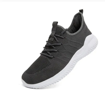 Men's black and white mesh sneakers with a lace-up front and round toe, shown on a plain background.