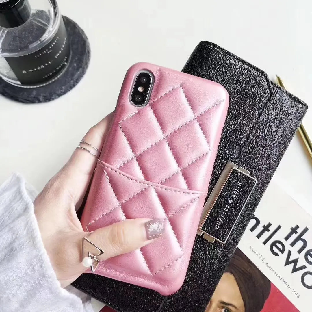 Leather mobile phone case for iPhone XS Max in black, pink, and red colour options.