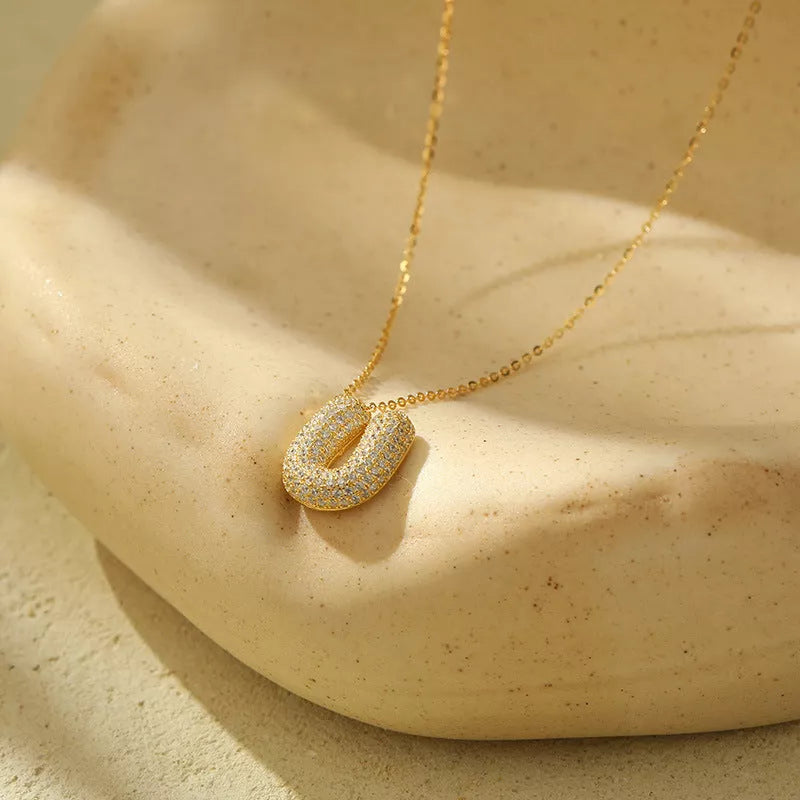 Stainless steel initial pendant necklace with zircon accents, personalized with your choice of letter.