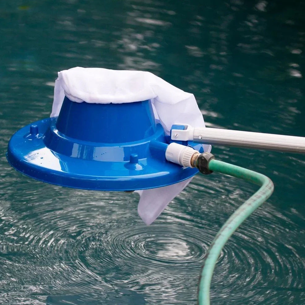 Blue swimming pool vacuum cleaner with suction head and mesh bag for garden hose attachment