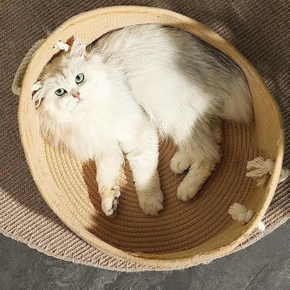 Natural wicker cat basket with integrated corrugated cardboard scratching panel side.