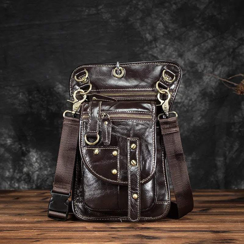 Men's black punk fanny pack with cowhide leather, zipper closure, and internal phone and ID compartments.