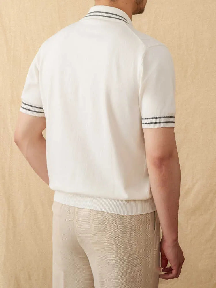 Casual apricot coloured lapel collar polo shirt made from thin cotton blend fabric on a hanger.