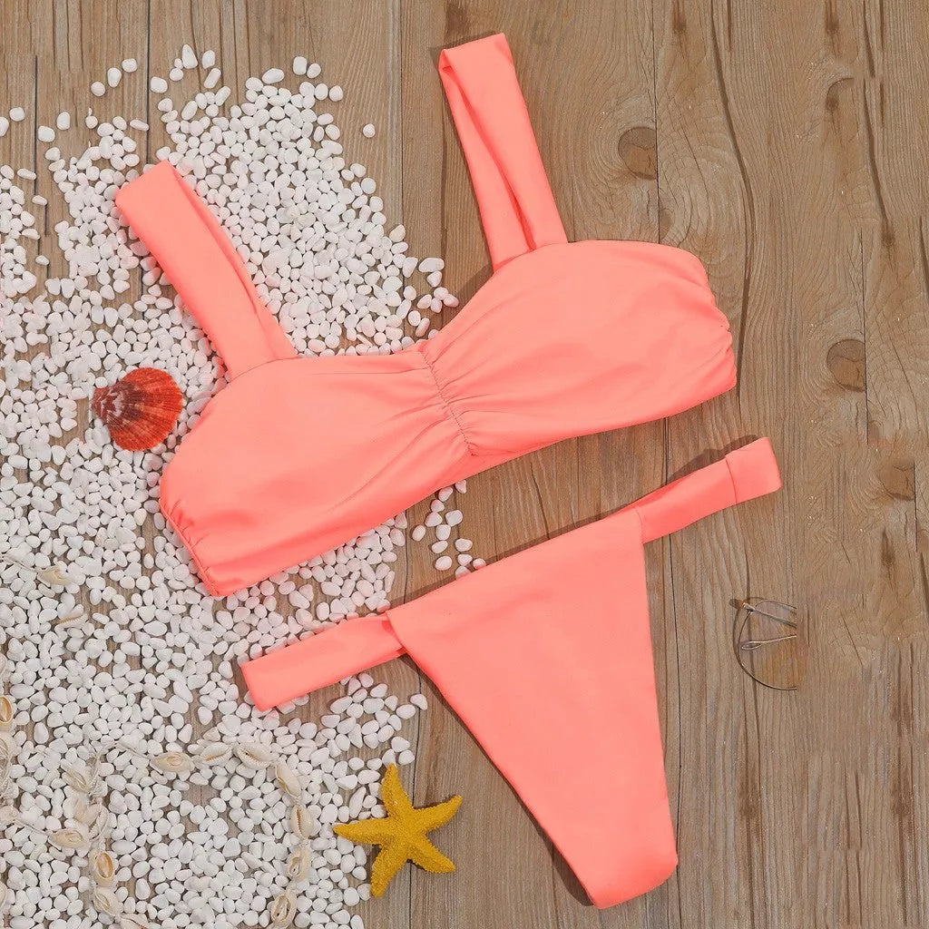 Solid color split bikini swimsuit in orange with nylon fabric and polyester lining