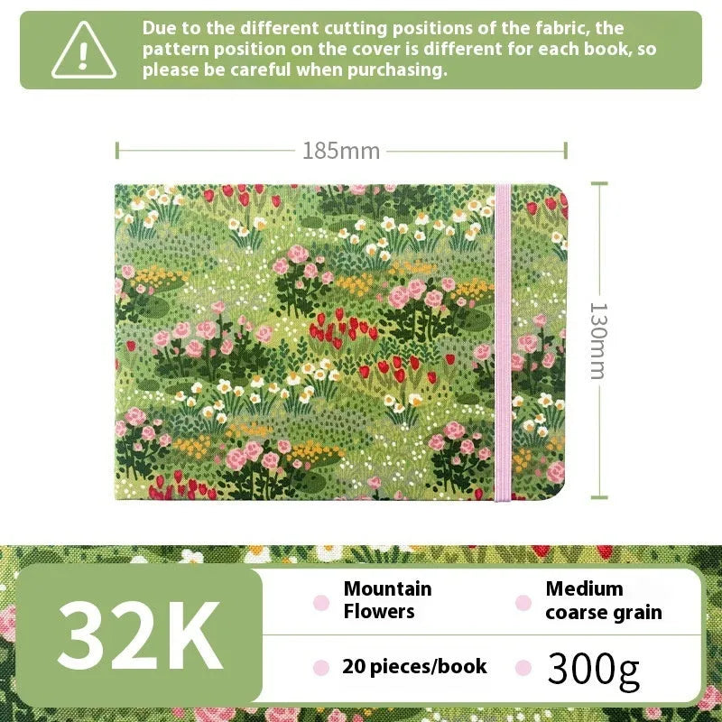 Feiluniao watercolour notebook with fabric cover, 185mm length, open to show paper for painting.