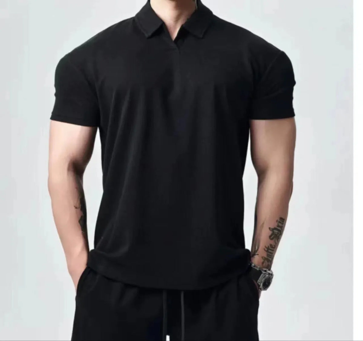 Men's loose fit retro T-shirt shown in black with a Henry collar on a mannequin.