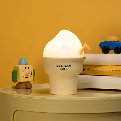 Abstract duck night lamp with ice cream colours measuring 103mm tall with USB charging port