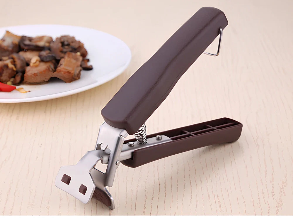 Stainless steel tray holder gripping baking tray with non-slip chuck mechanism and widened handle