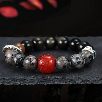 Gold obsidian, flame stone and red agate beads on unisex bracelet with manual processing