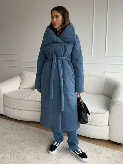 Cozy women's long winter coat with large lapel, lace-up design, and pockets for optimal warmth and style
