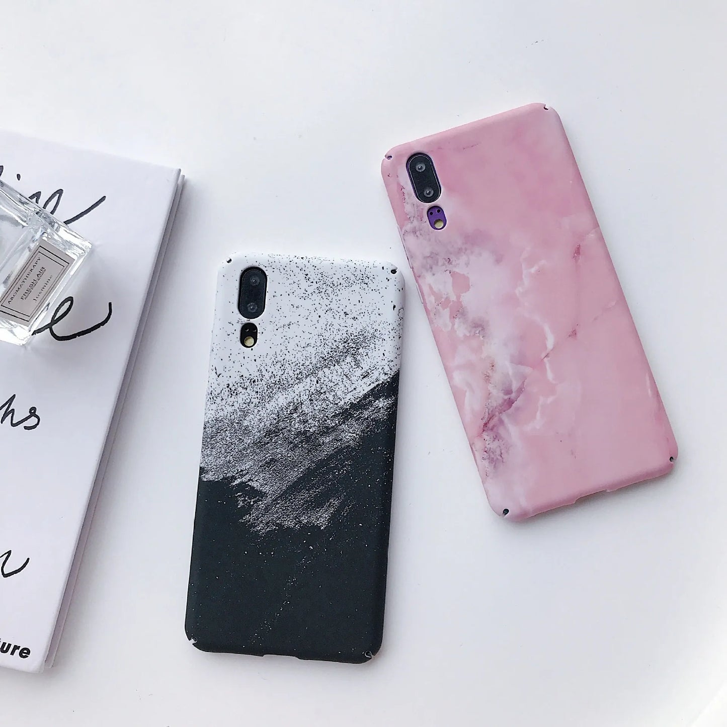 Black and pink painted hard PC phone cases for Honor and Huawei smartphones.