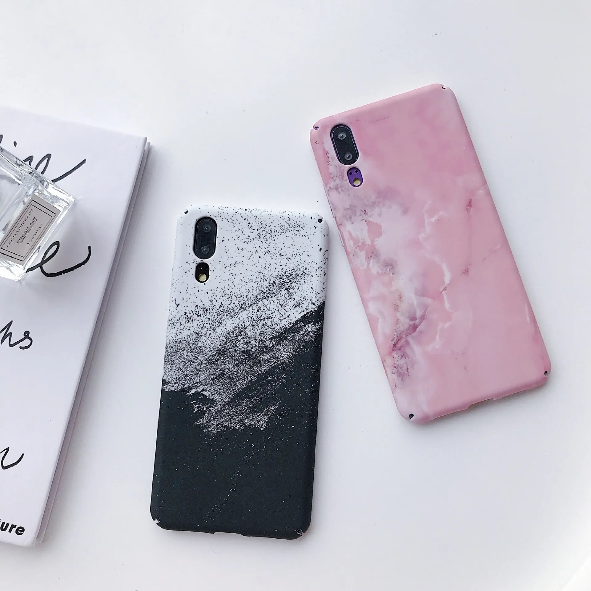 Black and pink painted hard PC phone cases for Honor and Huawei smartphones.