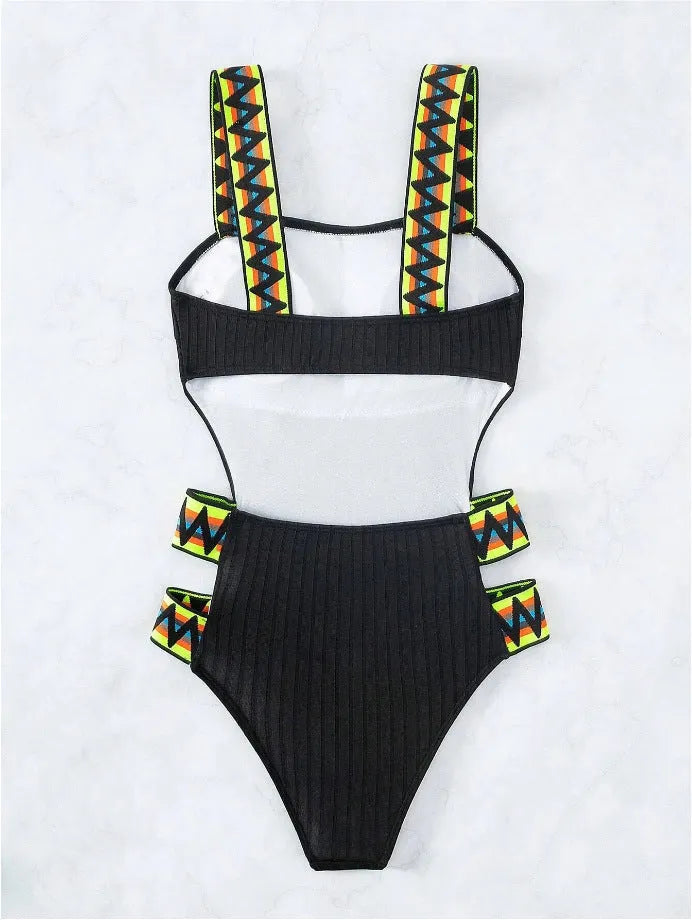 Women's solid colour one-piece swimsuit in black or orange options with polyester fabric construction