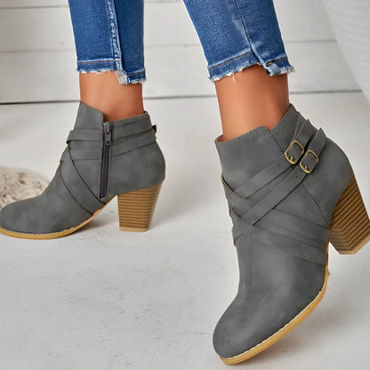 Women's plus size black PU leather short ankle boots with a 7cm heel and side zipper.