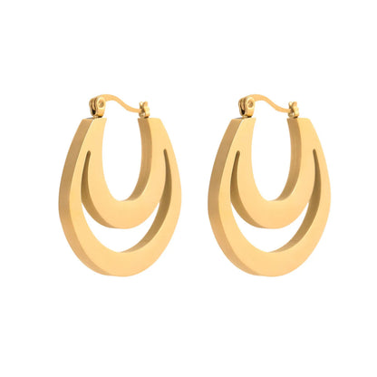 Geometric metallic French earrings in gold or steel colours with round ring design elements