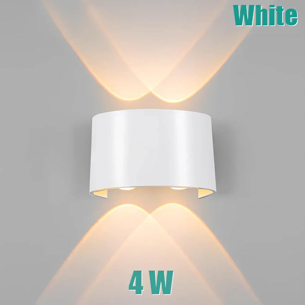 Waterproof black aluminium LED wall lamp 4W warm white emitting 60-degree beam angle mounted on white wall