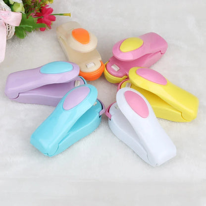 Mini hand pressure heat sealing machine measuring 10cm with magnetic base for plastic bag food preservation