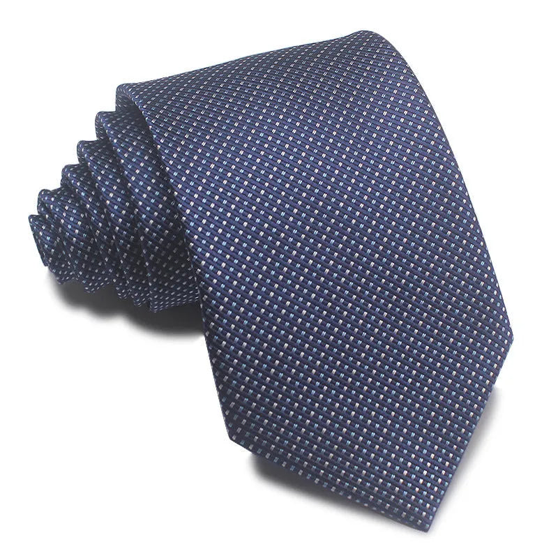 Close-up of a red and black striped jacquard weave tie with an arrow tip, showing texture.