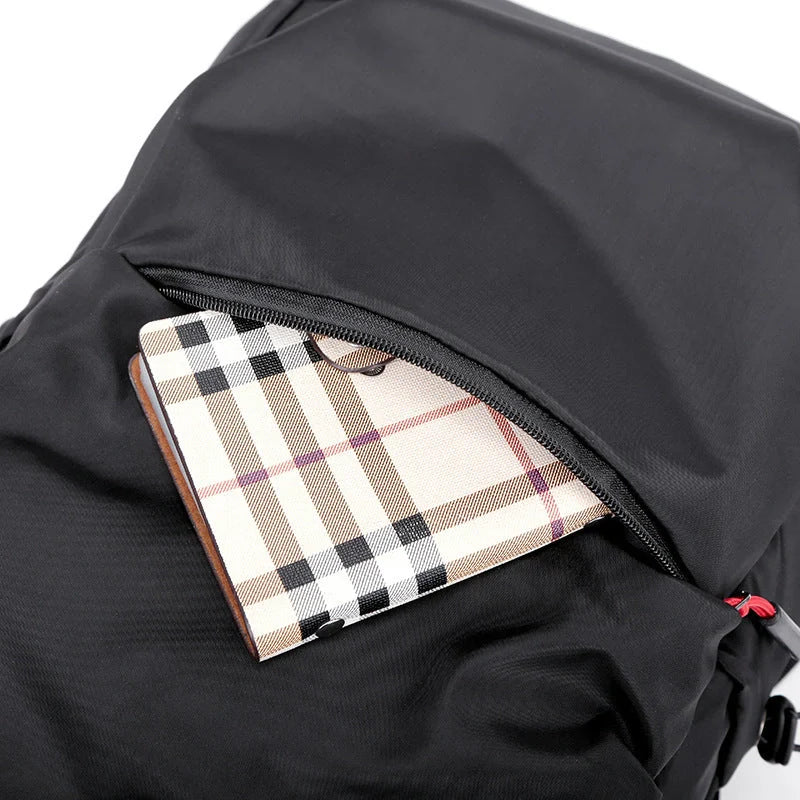 Sleek and durable nylon backpack with spacious compartments for everyday use.