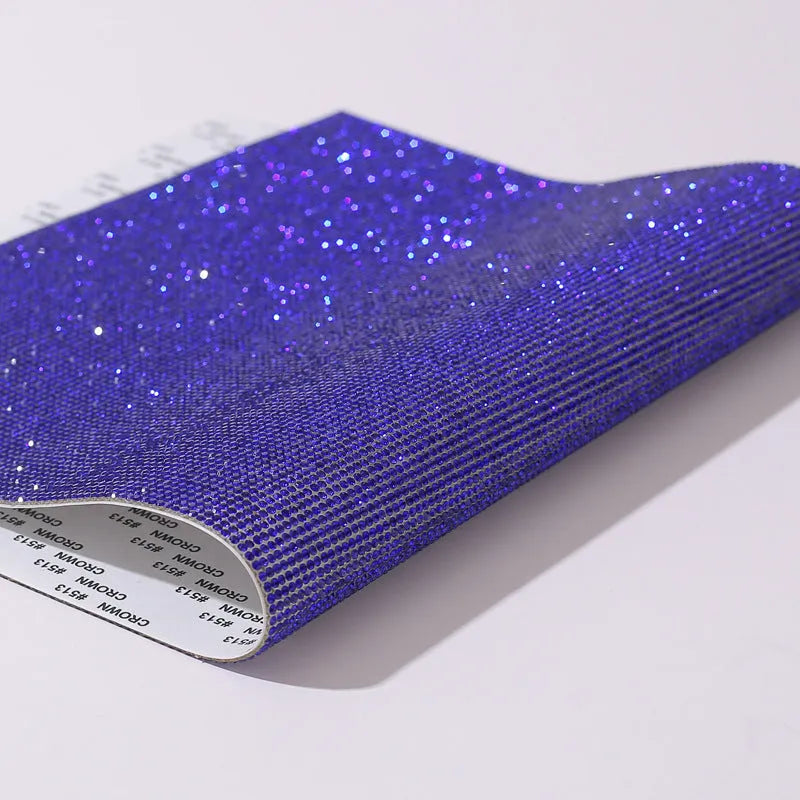 Rhinestone sticker net on backing sheet for hot drilling application to fabrics in multiple colour options