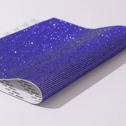 Rhinestone sticker net on backing sheet for hot drilling application to fabrics in multiple colour options