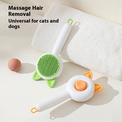 Greenish white pet grooming brush with stainless steel teeth, a push-button, and orange massage beads on the handle.