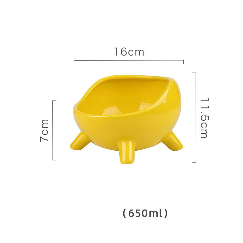 Green ceramic cat food bowl with four legs and elevated design for stable feeding