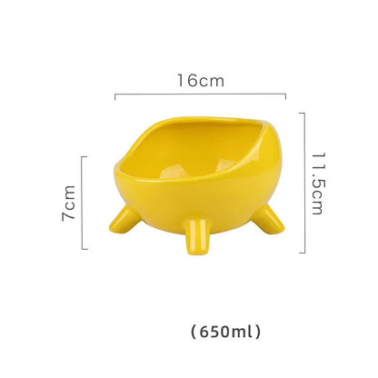 Green ceramic cat food bowl with four legs and elevated design for stable feeding