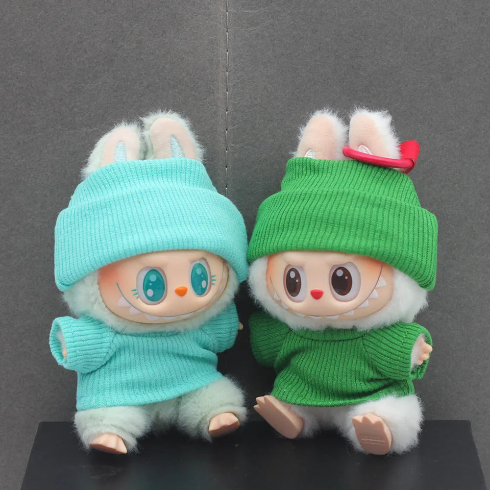 Doll clothes set with knitted flanging hat and T-shirt in multiple colours including pink, white, and stripes.